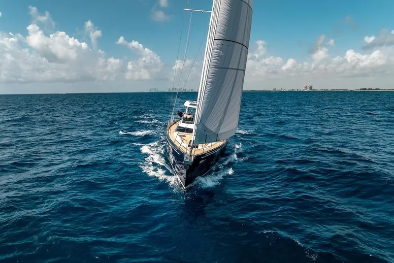 Slide: The Image of Sailing yacht Hylas H57 2025 gliding on open ocean under clear blue sky. - 12