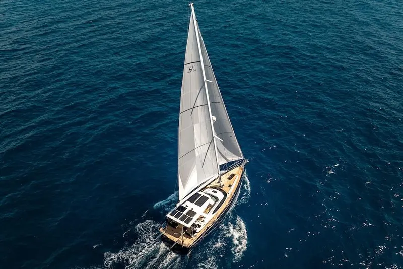 Slide: The Image of Sailing yacht Hylas H57 2025 gliding on open blue sea. - 16