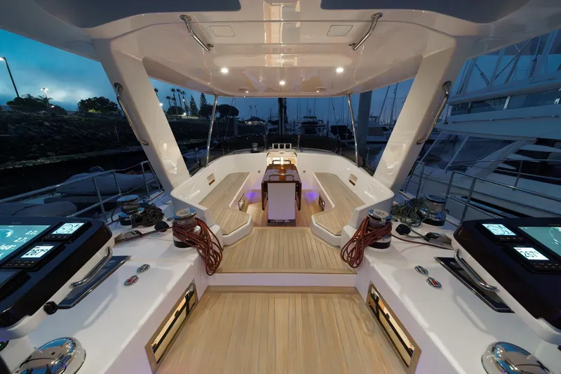 Slide: The Image of Luxurious 2025 Hylas H57 yacht cockpit with modern navigation systems and elegant seating. - 19