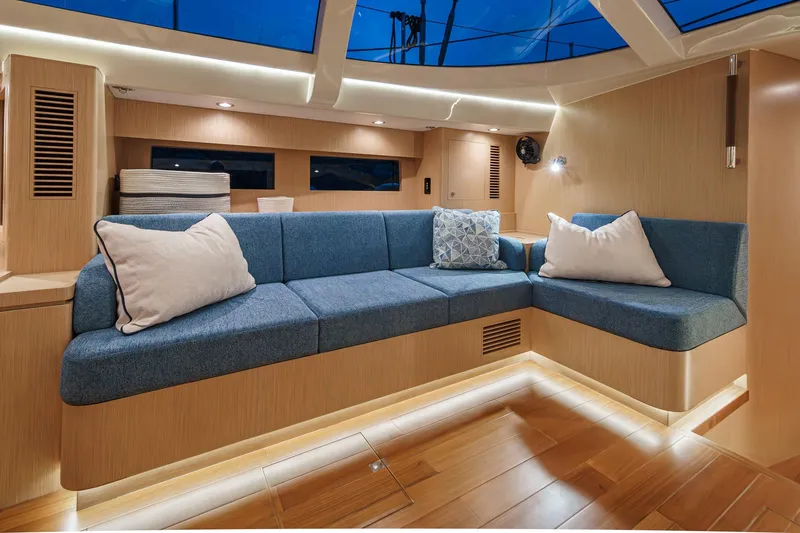 Slide: The Image of Luxurious interior of 2025 Hylas H57 yacht with modern blue seating and ambient lighting. - 29