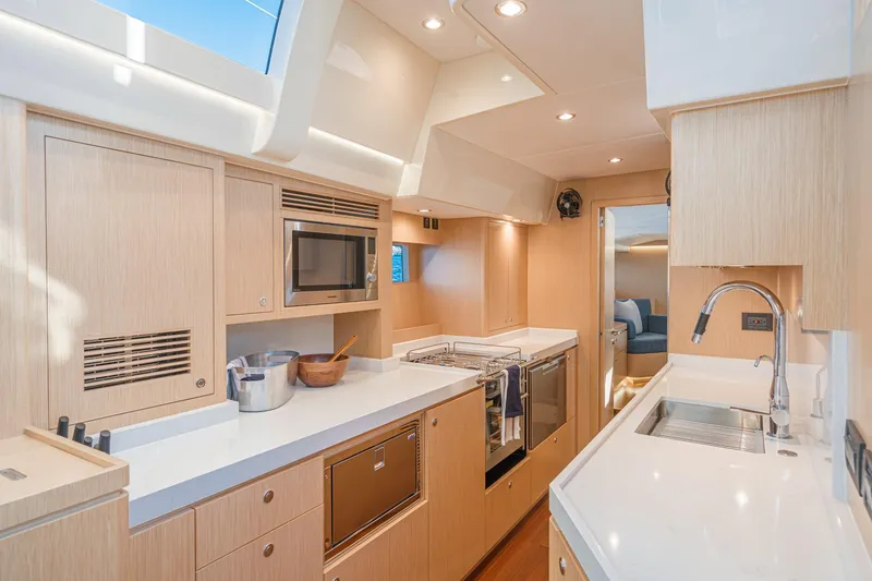 Slide: The Image of Luxurious 2025 Hylas H57 yacht kitchen with modern appliances and sleek design. - 33