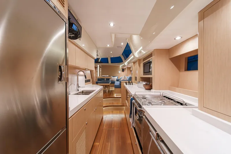 Slide: The Image of Luxurious interior of 2025 Hylas H57 yacht featuring modern kitchen and sleek design. - 37