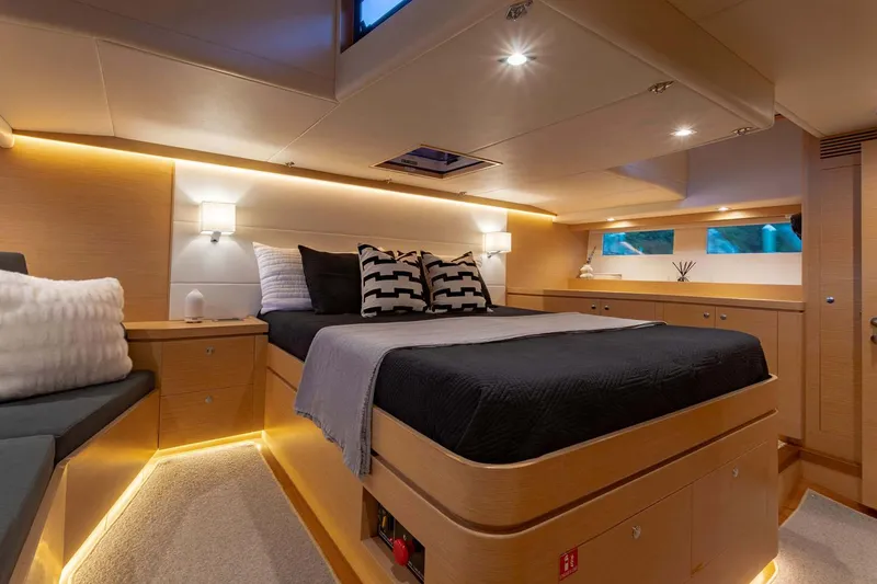 Slide: The Image of Manufacturer Provided Image: Luxurious cabin interior of 2025 Hylas H57 yacht with modern lighting and elegant bedding. - 39