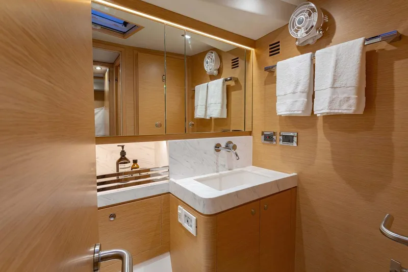 Slide: The Image of Manufacturer Provided Image: Luxurious bathroom in 2025 Hylas H57 yacht with modern fixtures and wooden cabinetry. - 42