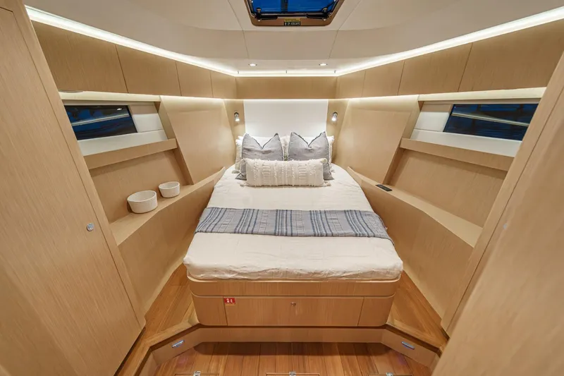 Slide: The Image of Luxurious 2025 Hylas H57 yacht cabin with modern design and cozy bedding. - 43