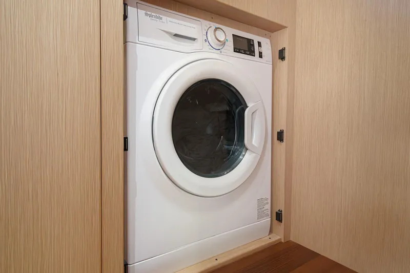 Slide: The Image of Built-in washing machine on Hylas H57 yacht, 2025 model, in wooden cabinet. - 45