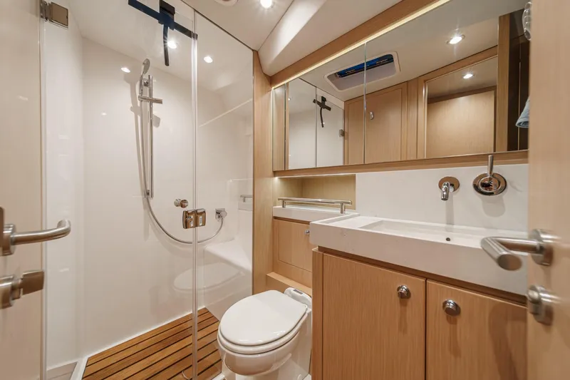 Slide: The Image of Luxurious bathroom interior of 2025 Hylas H57 yacht with modern fixtures and wooden accents. - 47