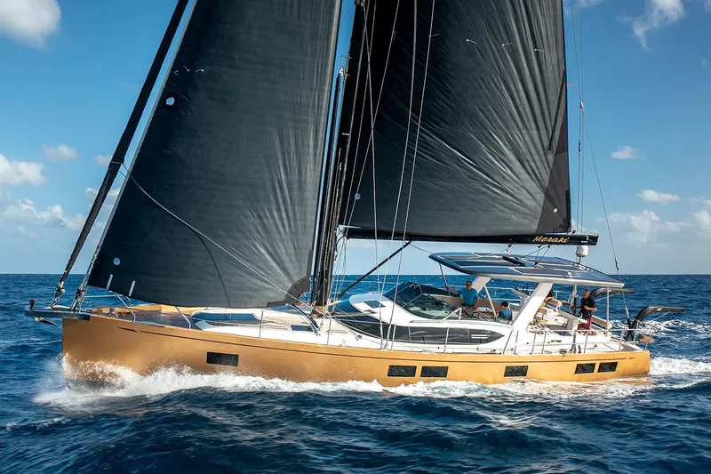 Slide: The Image of Manufacturer Provided Image: 2025 Hylas H57 yacht sailing on open sea with black sails. - 5