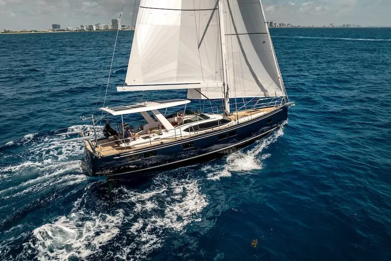 Slide: The Image of Sailing yacht Hylas H57 2025 cruising on open blue sea under clear skies. - 9
