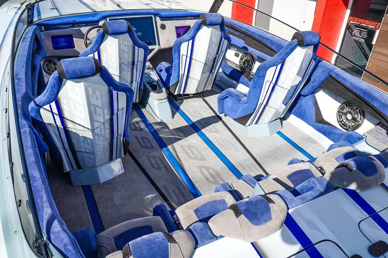 Slide: The Image of Interior of 2026 Statement 396 boat with blue and white seating and modern dashboard. - 16