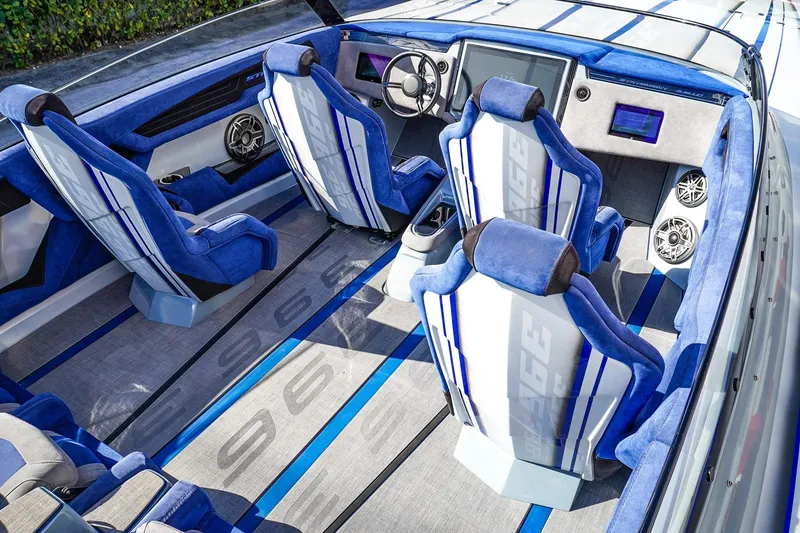 Slide: The Image of Luxurious interior of 2026 Statement 396 boat with blue and white seating and advanced dashboard. - 18