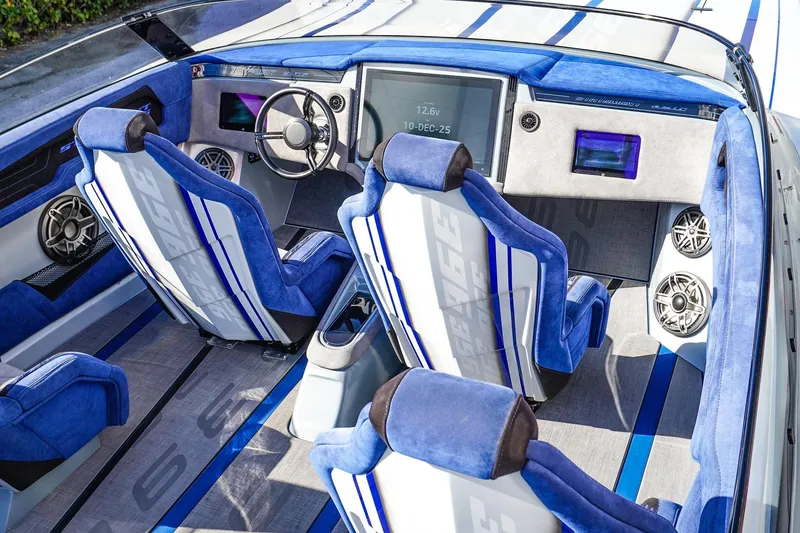 Slide: The Image of Luxurious interior of 2026 Statement 396 boat with blue and white seating and advanced dashboard. - 20