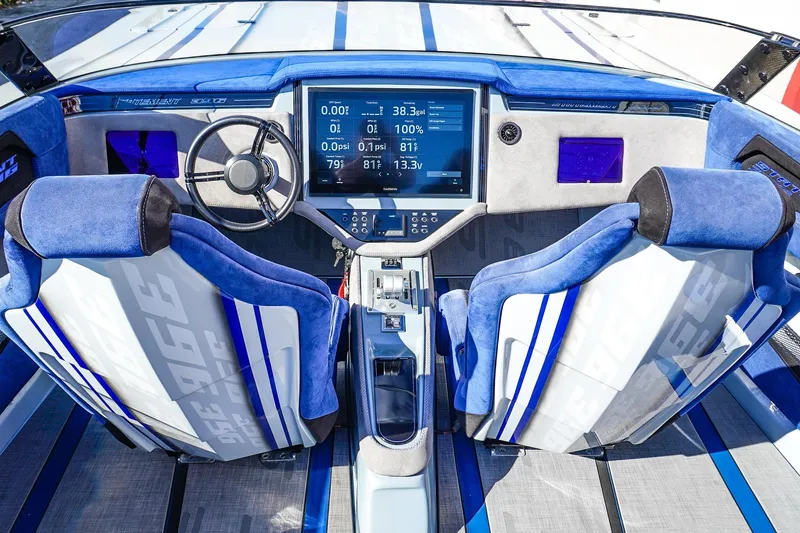 Slide: The Image of Interior of a 2026 Statement 396 boat with blue seats and advanced dashboard. - 28