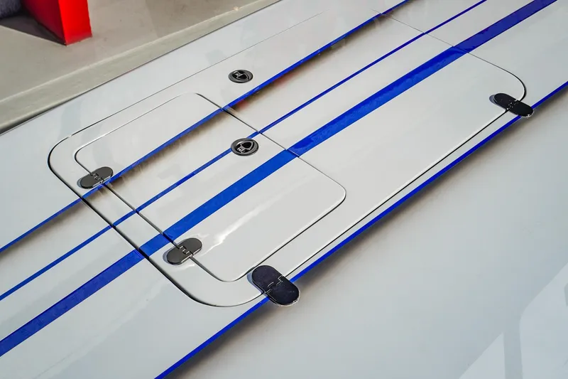 Slide: The Image of 2026 Statement 396 boat deck with blue stripes and storage hatches. - 44