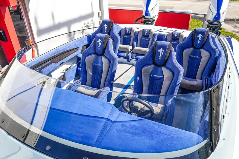 Slide: The Image of Luxurious 2026 Statement 396 boat interior with blue and gray seating, featuring modern design elements. - 49