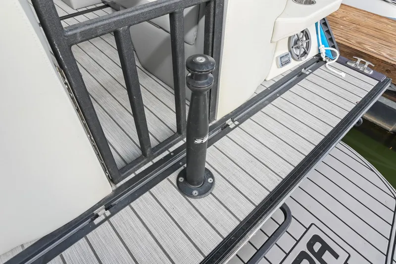 Slide: The Image of 2023 Montara 25 Monntara 2.0 boat deck with railing and speaker. - 15