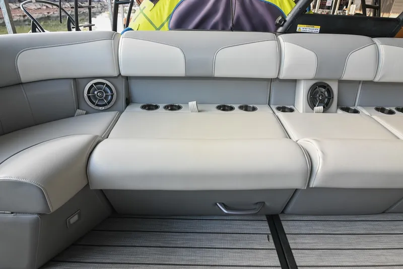Slide: The Image of Luxurious seating in 2023 Montara 25 Monntara 2.0 boat with integrated speakers and cup holders. - 23
