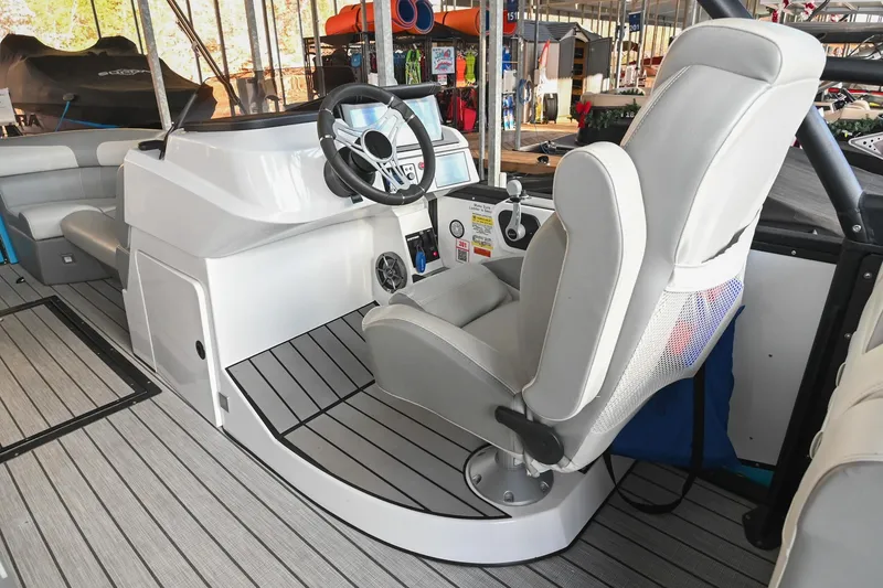 Slide: The Image of Interior of 2023 Montara 25 Monntara 2.0 boat with steering wheel and captain's chair. - 26