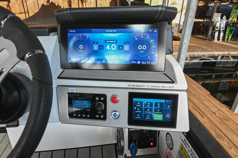 Slide: The Image of 2023 Montara 25 Monntara 2.0 dashboard with digital display and control panel. - 28