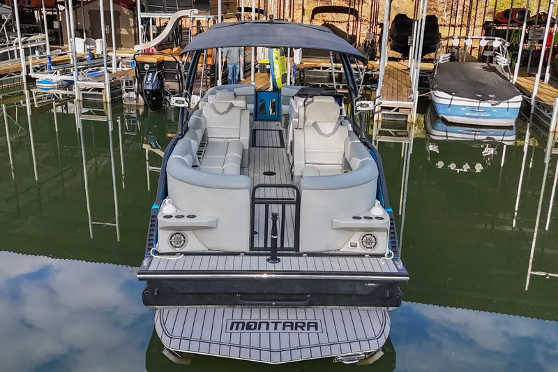 Slide: The Image of 2023 Montara 25 Monntara 2.0 boat docked, featuring spacious seating and modern design. - 3