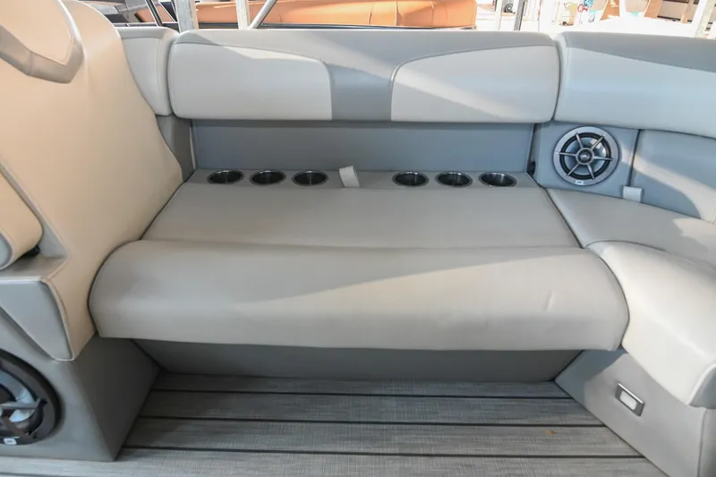 Slide: The Image of 2023 Montara 25 Monntara 2.0 boat interior with cushioned seating and cup holders. - 37