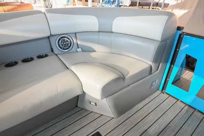 Slide: The Image of 2023 Montara 25 Monntara 2.0 boat interior with gray seating and cup holders. - 38