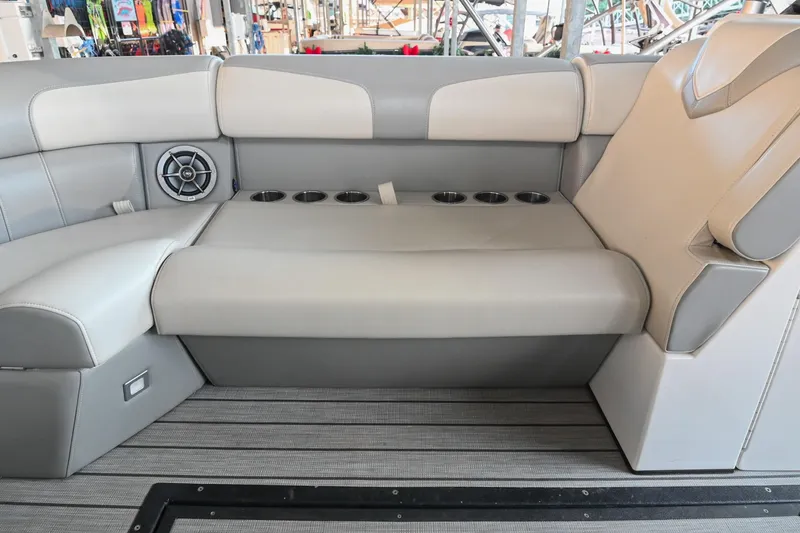 Slide: The Image of 2023 Montara 25 Montara 2.0 boat interior with cushioned seating and cup holders. - 41