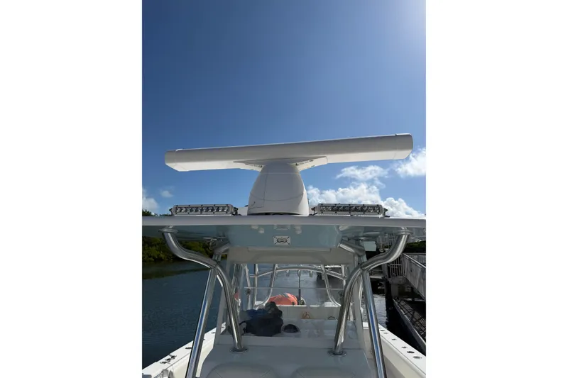 Slide: The Image of 2022 SeaHunter 38 CTS boat with radar, clear sky background. - 6