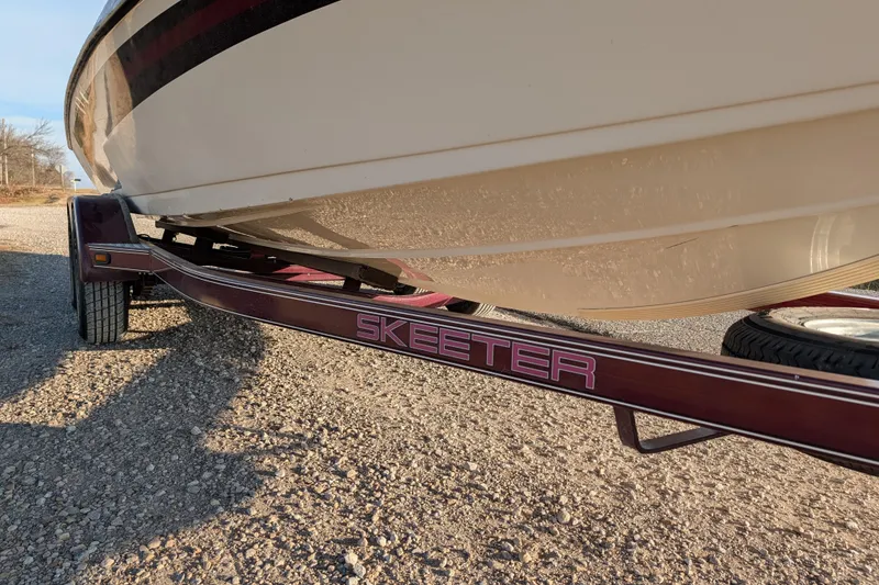 Slide: The Image of 2009 Skeeter SL1900 boat on trailer, side view, sunny day. - 11