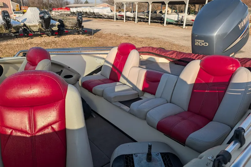 Slide: The Image of 2009 Skeeter SL1900 boat interior with red and white seats, Yamaha 200 engine visible. - 18