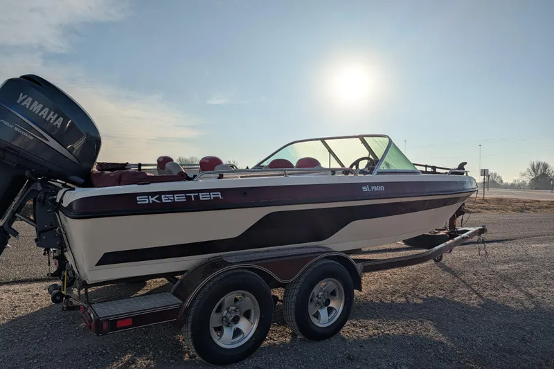 Slide: The Image of 2009 Skeeter SL1900 boat with Yamaha engine on trailer, sunny day background. - 8