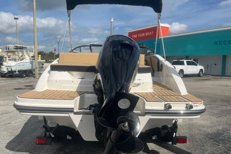 Slide: The Image of 2024 Sea Ray SPX 210 Outboard boat with sleek design and powerful engine. - 12