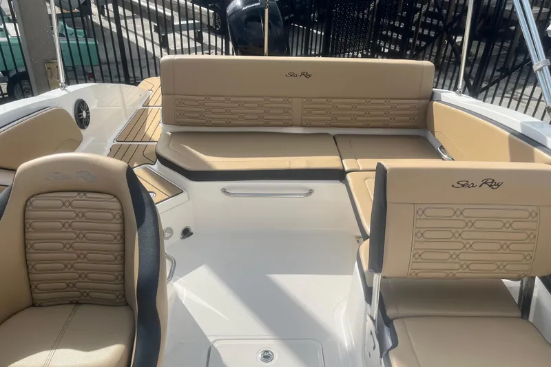 Slide: The Image of Interior of 2024 Sea Ray SPX 210 Outboard with beige seating. - 9