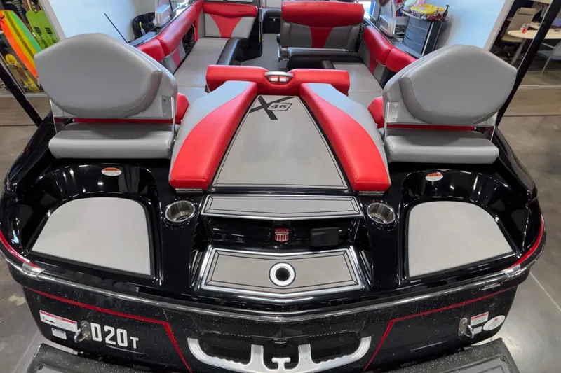 Slide: The Image of 2017 MasterCraft X46 boat interior with red and gray seating, sleek design. - 11