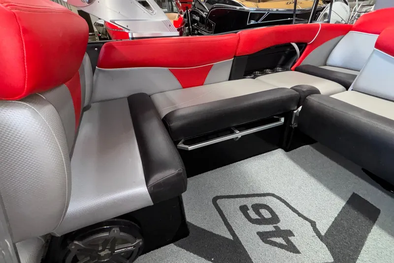 Slide: The Image of 2017 MasterCraft X46 interior with red and gray seating, showcasing luxury boat design. - 18