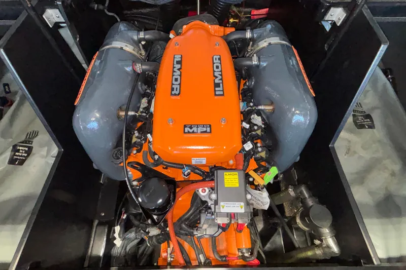 Slide: The Image of 2017 MasterCraft X46 Ilmor engine, vibrant orange cover, detailed view. - 25