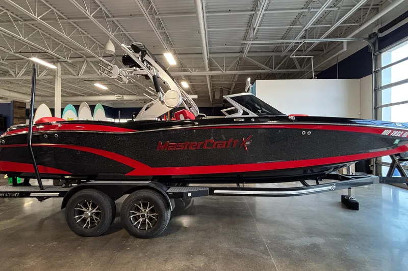Slide: The Image of 2017 MasterCraft X46 boat on trailer in indoor showroom. - 3