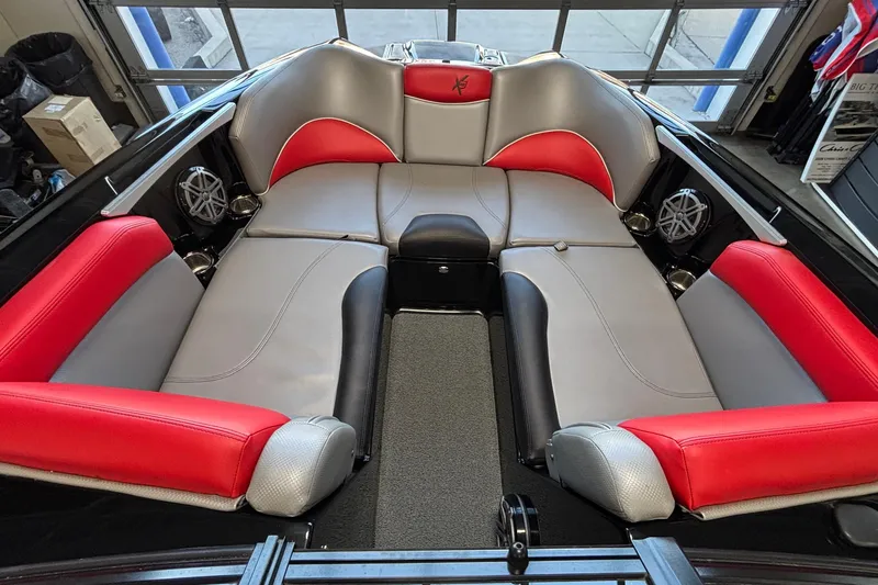 Slide: The Image of 2017 MasterCraft X46 boat interior with red and gray seating. - 30