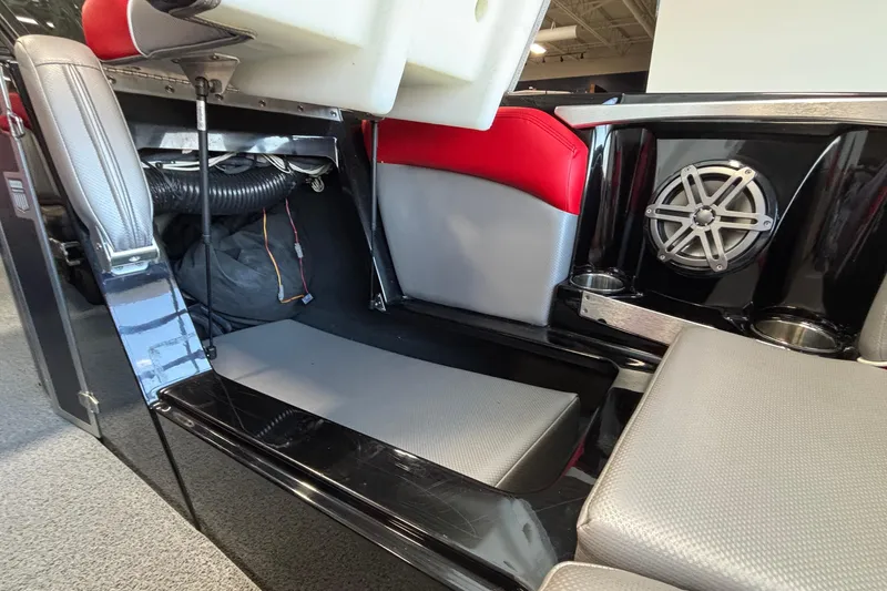 Slide: The Image of 2017 MasterCraft X46 boat interior with storage compartment and speaker system. - 34