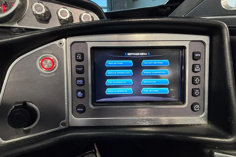 Slide: The Image of 2017 MasterCraft X46 dashboard with touchscreen settings menu and engine start/stop button. - 42