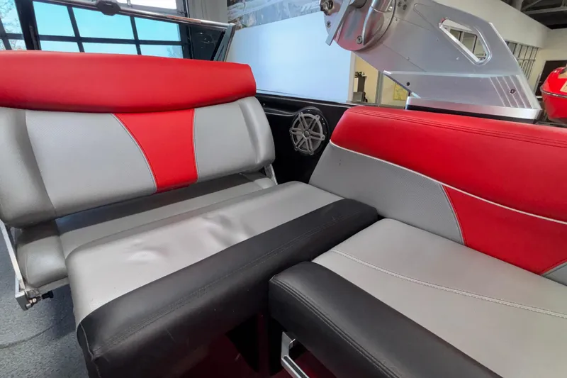 Slide: The Image of 2017 MasterCraft X46 interior with red, gray, and black seating, showcasing modern design. - 45