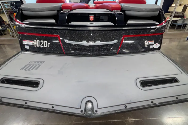 Slide: The Image of 2017 MasterCraft X46 boat rear view with red and black detailing. - 48