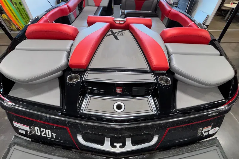 Slide: The Image of 2017 MasterCraft X46 boat interior with red and gray seating, sleek design. - 8