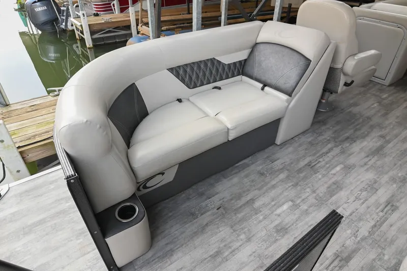 Slide: The Image of Luxurious seating on 2021 Crest Classic DLX 220 L pontoon boat, featuring elegant upholstery. - 14