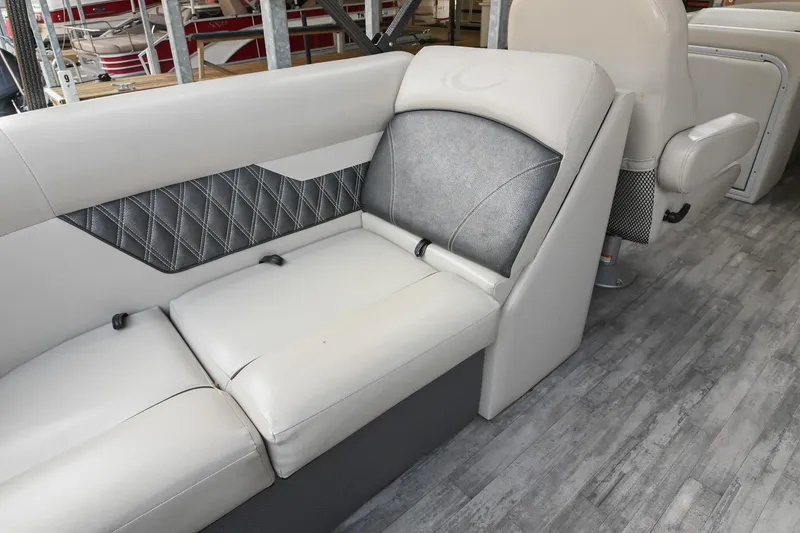 Slide: The Image of 2021 Crest Classic DLX 220 L boat interior with gray cushioned seating. - 17