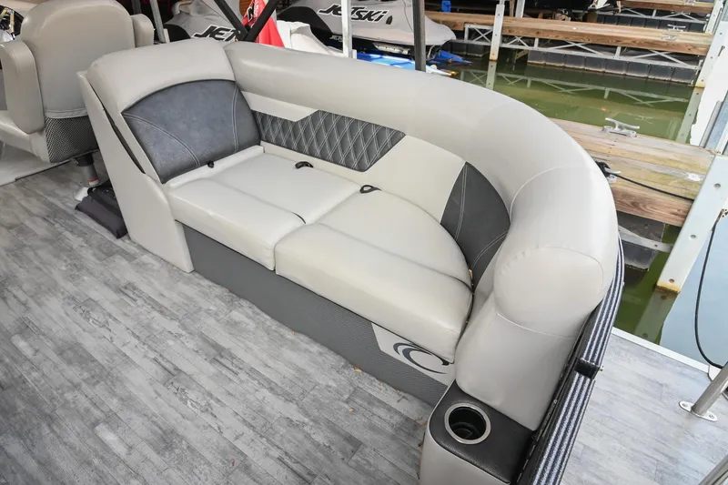 Slide: The Image of 2021 Crest Classic DLX 220 L pontoon boat interior with gray cushioned seating. - 18