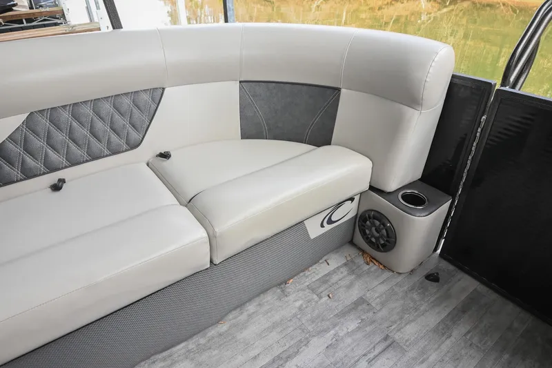 Slide: The Image of Luxurious seating in 2021 Crest Classic DLX 220 L pontoon boat with speaker and cup holder. - 19