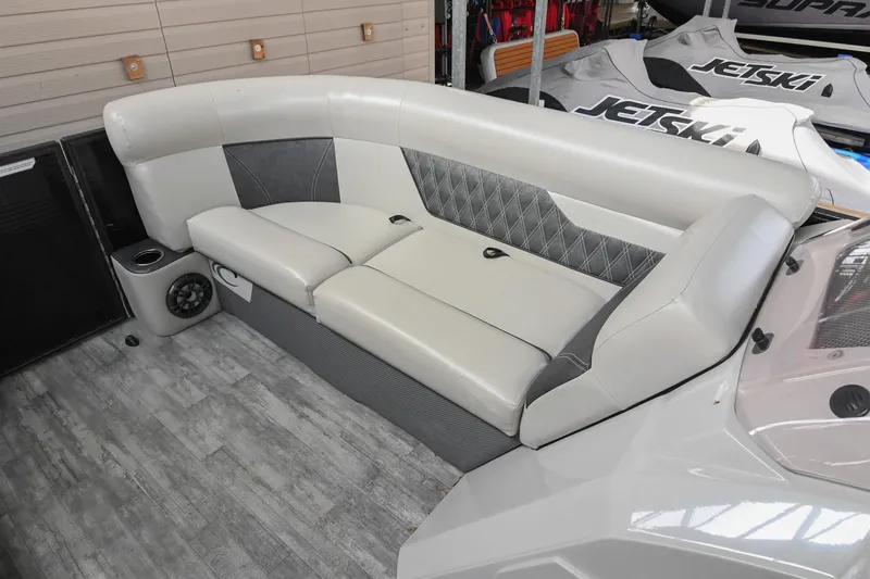 Slide: The Image of 2021 Crest Classic DLX 220 L boat interior with plush seating and modern design. - 37