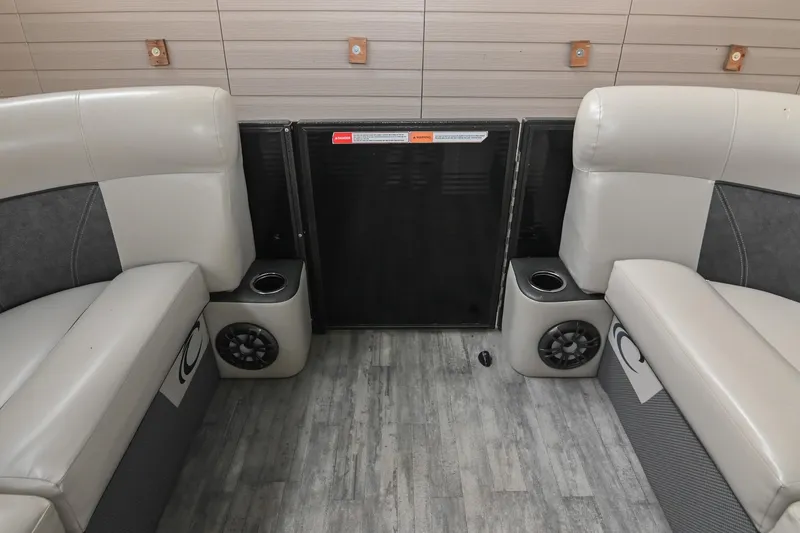 Slide: The Image of 2021 Crest Classic DLX 220 L interior with beige seating and built-in speakers. - 41