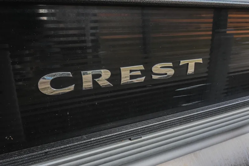 Slide: The Image of 2021 Crest Classic DLX 220 L logo on black surface. - 5